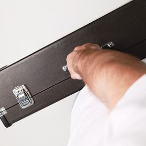 Hold a locked case with the narrow side toward you